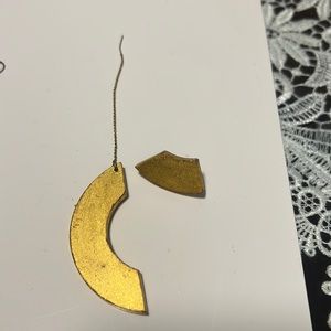 Assymetrical wood painted gold.